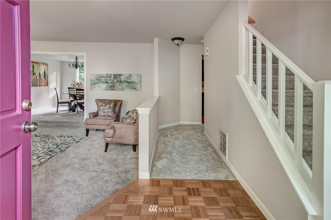 23613 Meridian Place West Bothell, WA 98021 - Photo 4 of 32 a living room with furniture and a rug
