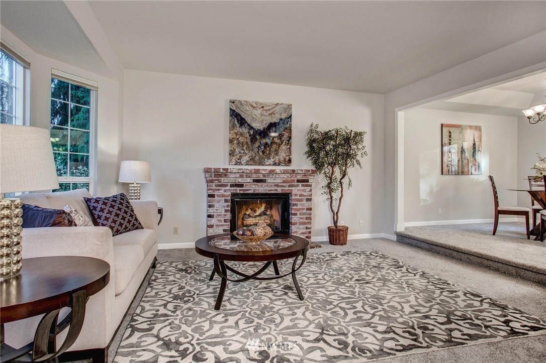 23613 Meridian Place West Bothell, WA 98021 - Photo 5 of 32 a living room with furniture and a fireplace