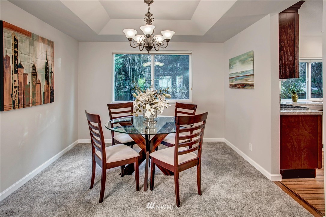 23613 Meridian Place West Bothell, WA 98021 - Photo 8 of 32 a dining room with furniture a chandelier and window