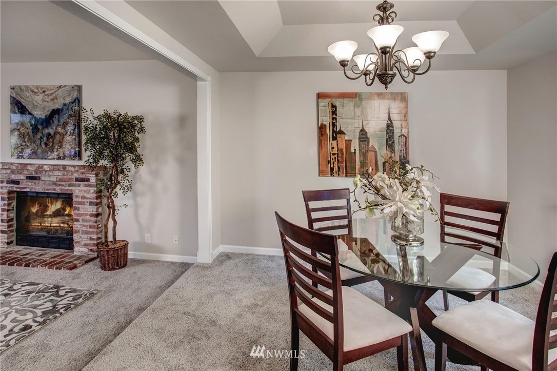 23613 Meridian Place West Bothell, WA 98021 - Photo 9 of 32 a view of a dining room with furniture and chandelier