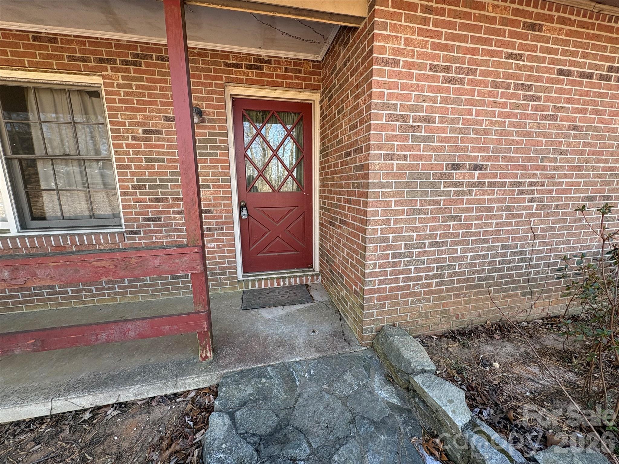 700 Summit Road Tryon, NC 28782 - Photo 15 of 27 a view of a brick house with an empty space