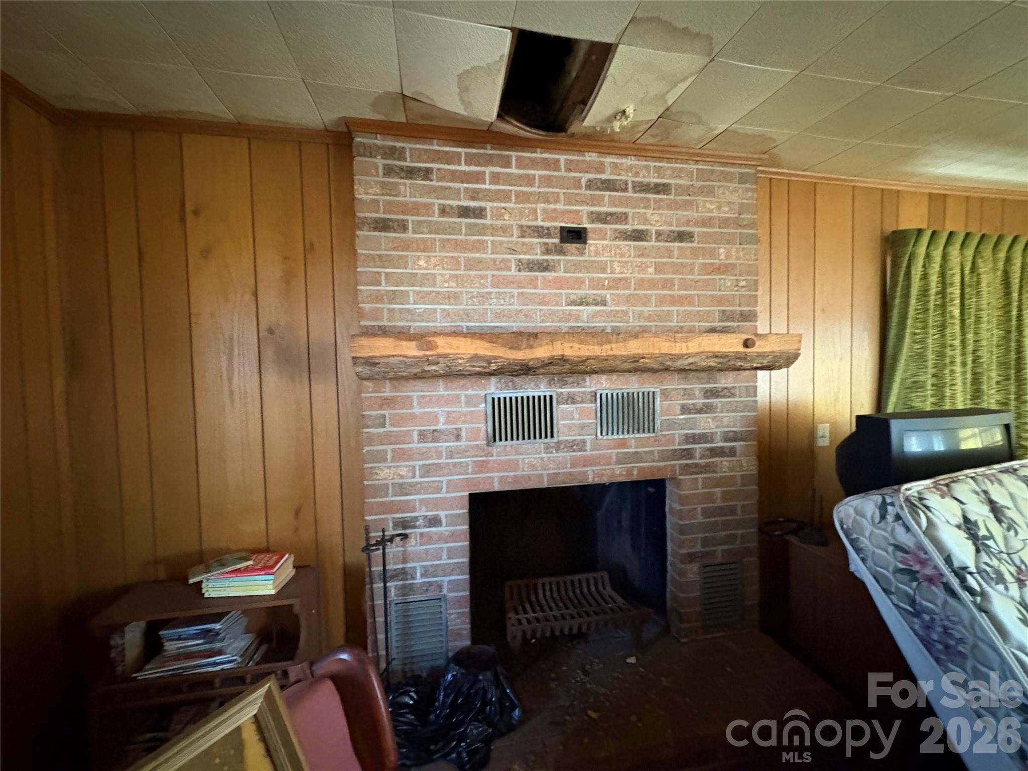 700 Summit Road Tryon, NC 28782 - Photo 17 of 27 a room with furniture and a fireplace