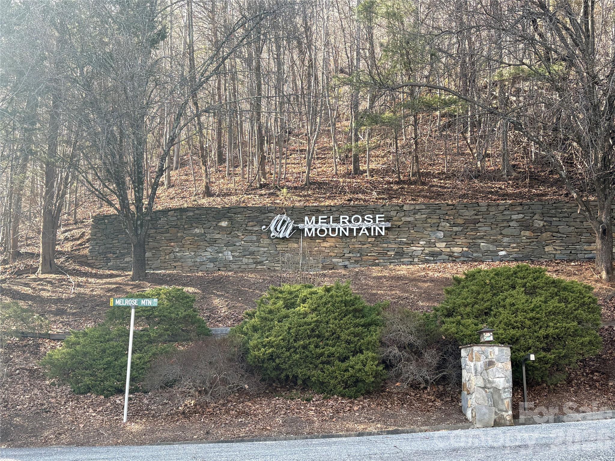 700 Summit Road Tryon, NC 28782 - Photo 2 of 27 a sign board with tall trees