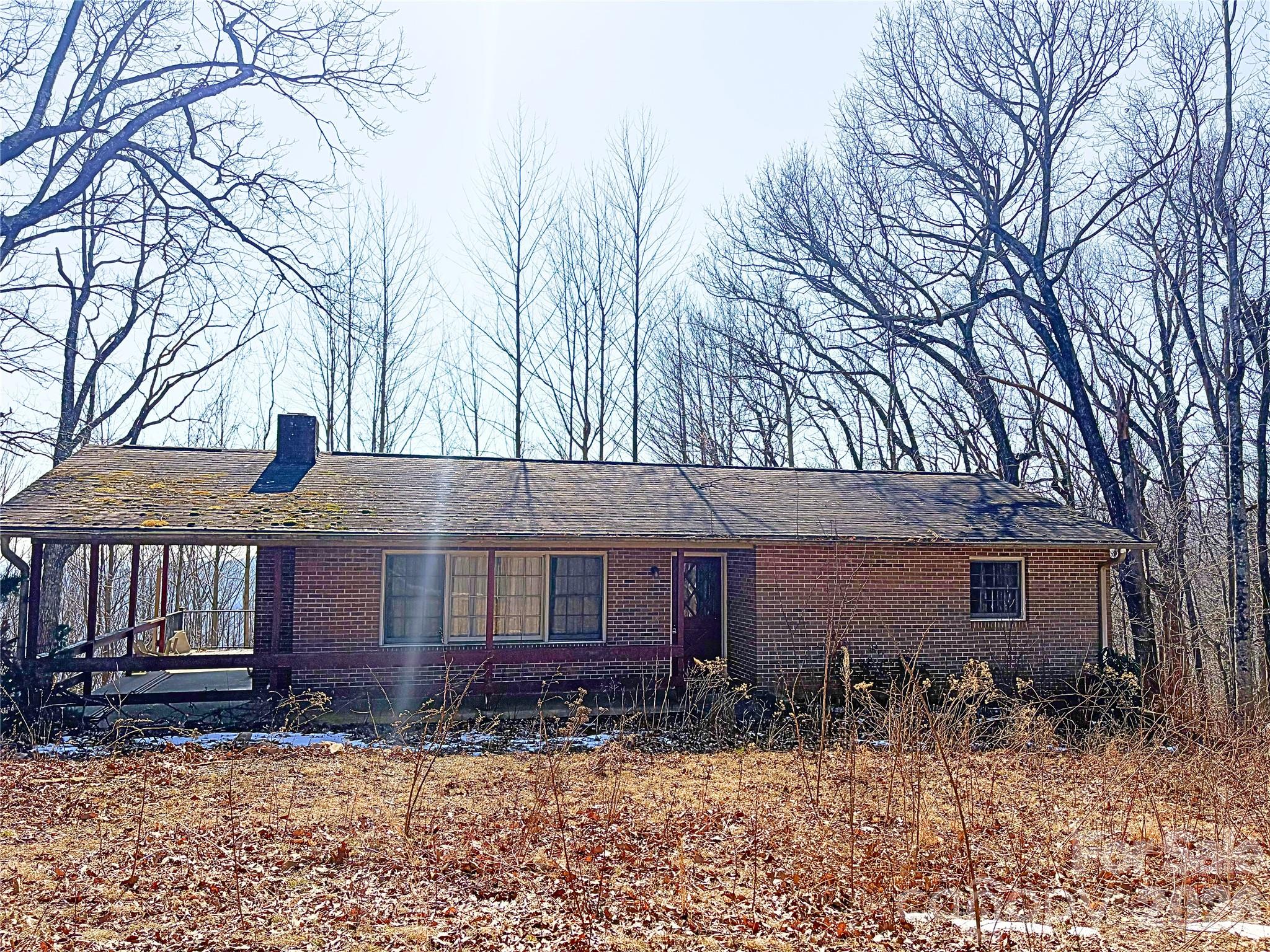 700 Summit Road Tryon, NC 28782 - Photo 5 of 27 a front view of a house with yard