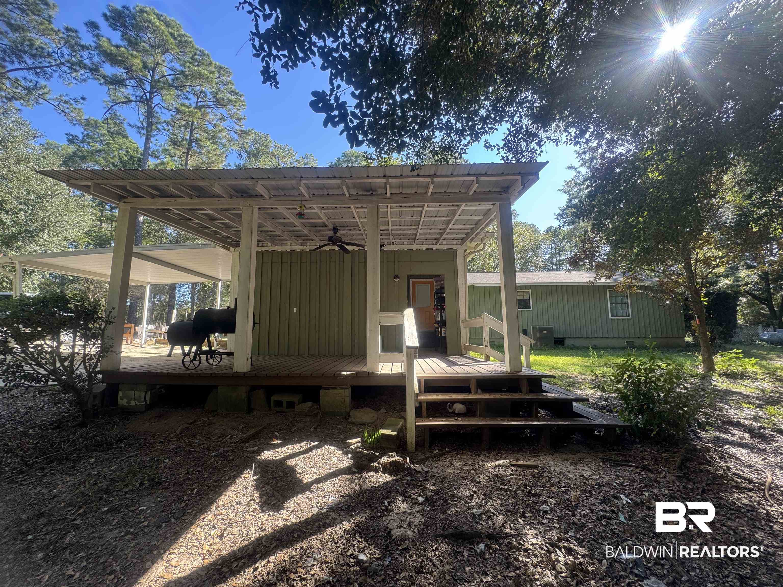 3097 Old Castleberry Road Brewton, AL 36426 - Photo 23 of 49 Back of house with a wooden deck, cooling unit, and ceiling fan