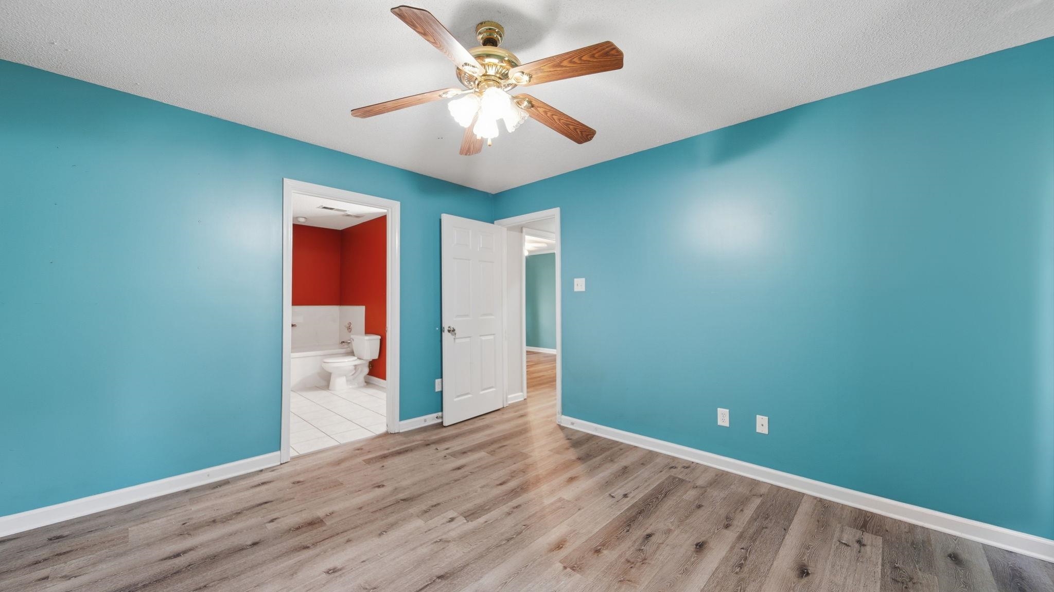 217 Rae Drive Munford, TN 38058 - Photo 19 of 40 Room with vibrant teal walls and wood-finish flooring