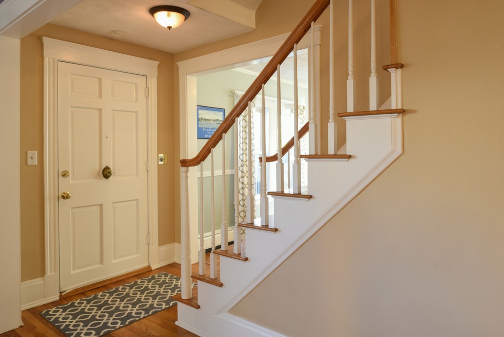 24 Homestead Road Marblehead, MA 01945 - Photo 4 of 29 a view of entryway with wooden floor and stairs