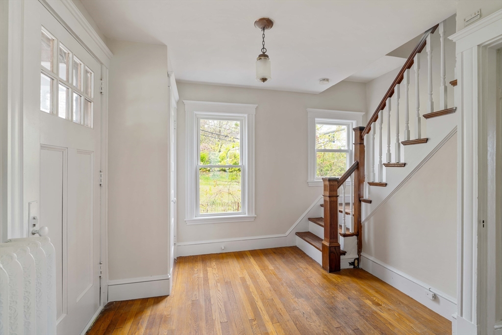 21 Perkins Avenue Boston, MA 02136 - Photo 11 of 26 a view of an entryway with wooden floor and stairs