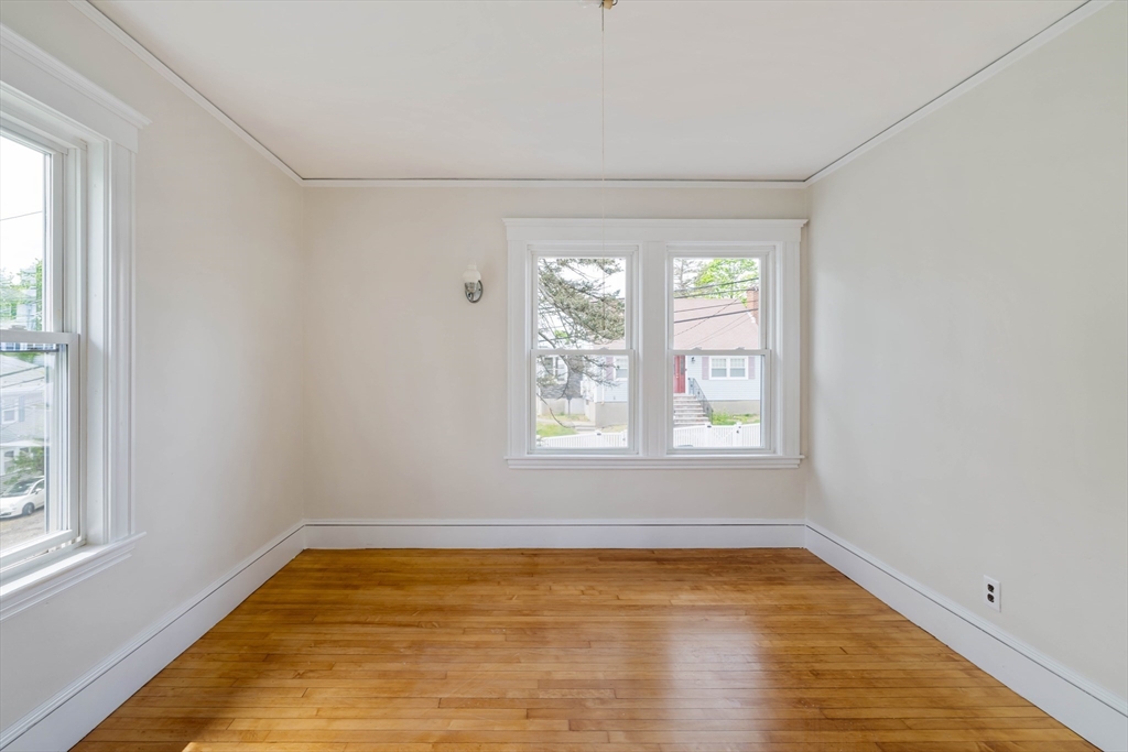 21 Perkins Avenue Boston, MA 02136 - Photo 13 of 26 a view of empty room with wooden floor and fan
