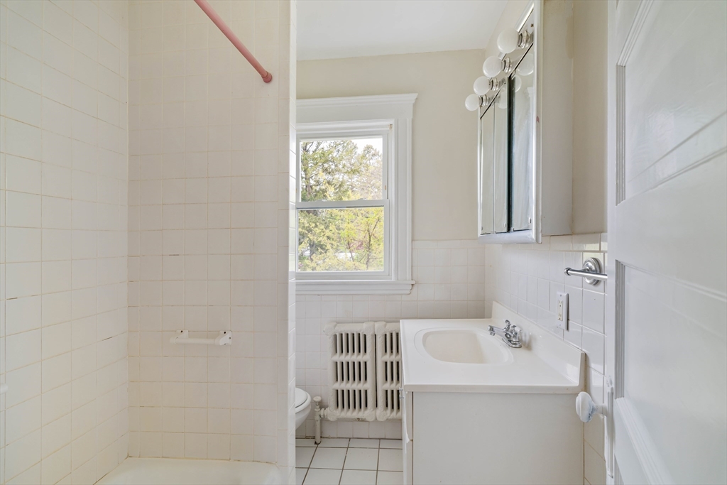 21 Perkins Avenue Boston, MA 02136 - Photo 19 of 26 a bathroom with a sink a toilet and a tub