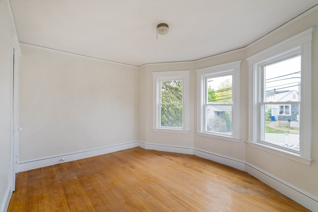21 Perkins Avenue Boston, MA 02136 - Photo 21 of 26 a view of an empty room with a window