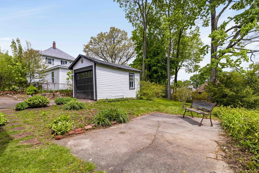 21 Perkins Avenue Boston, MA 02136 - Photo 25 of 26 a view of a backyard with potted plants and large trees