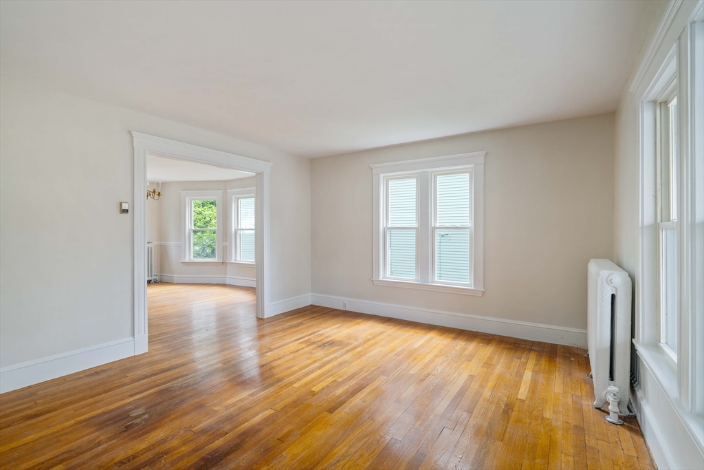 21 Perkins Avenue Boston, MA 02136 - Photo 5 of 26 a view of room with window and wooden floor