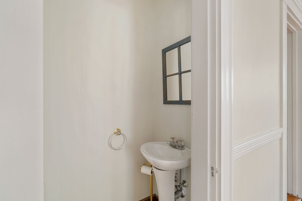 21 Perkins Avenue Boston, MA 02136 - Photo 7 of 26 a bathroom with a sink toilet and mirror