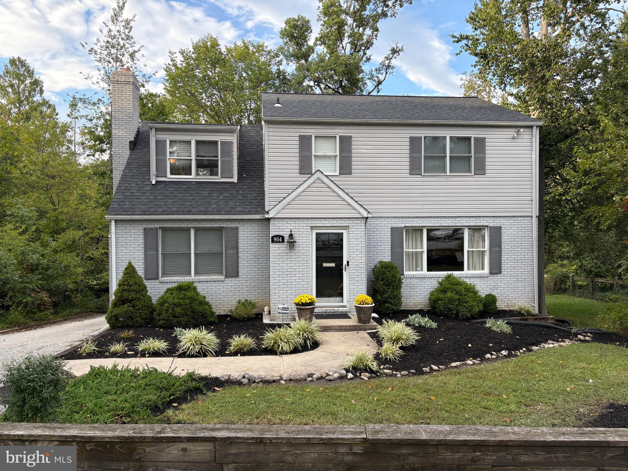 904 Litchfield Road Baltimore, MD 21239 - Photo 1 of 13 a front view of a house with garden