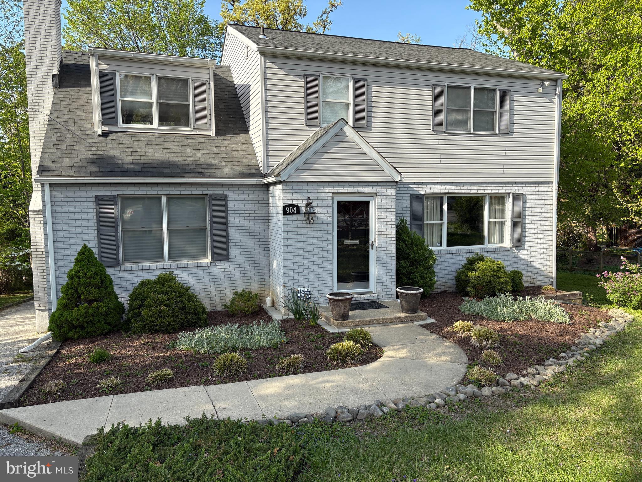 904 Litchfield Road Baltimore, MD 21239 - Photo 2 of 13 a front view of a house with yard and outdoor seating