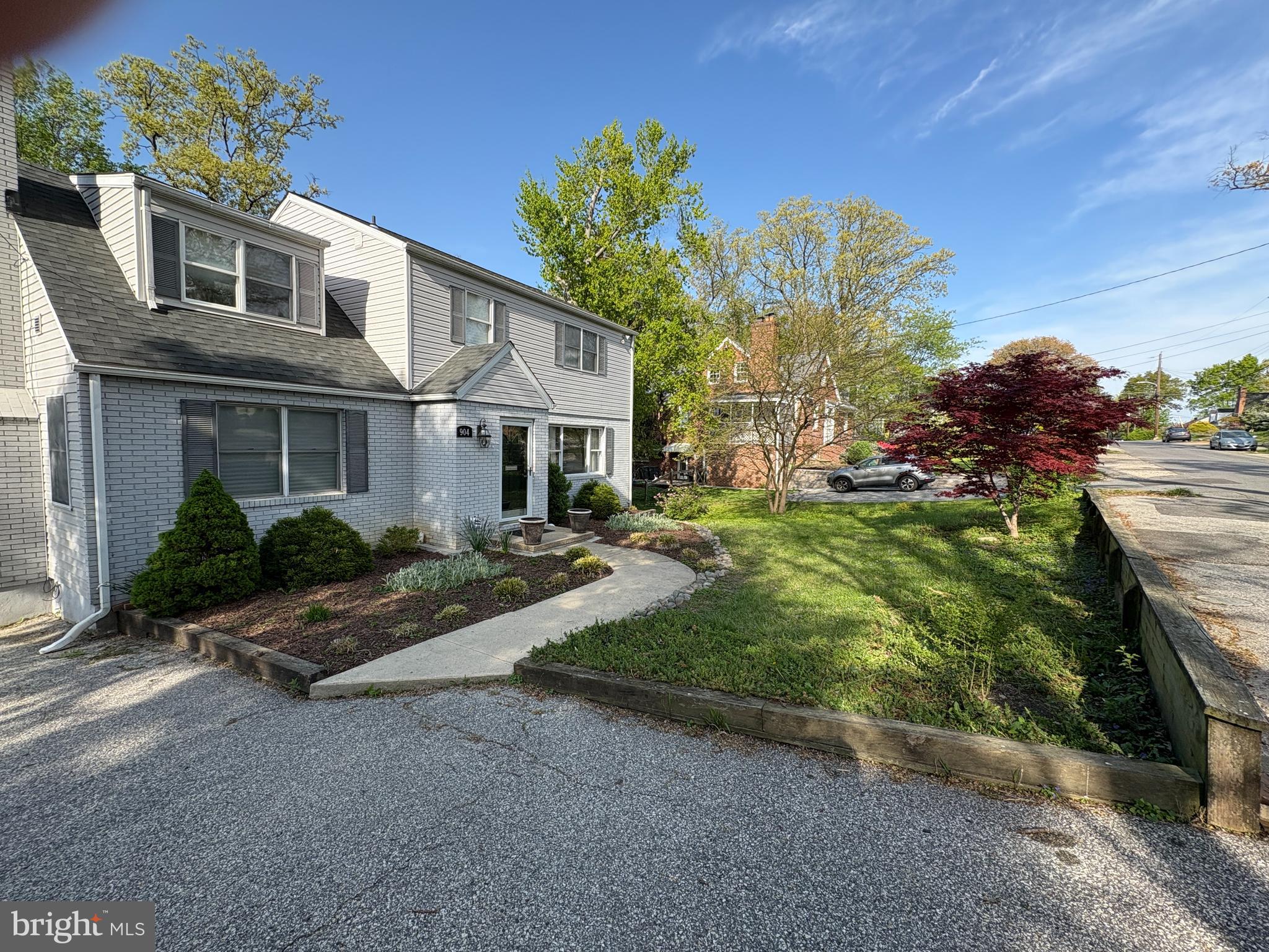 904 Litchfield Road Baltimore, MD 21239 - Photo 5 of 13 a front view of a house with a yard