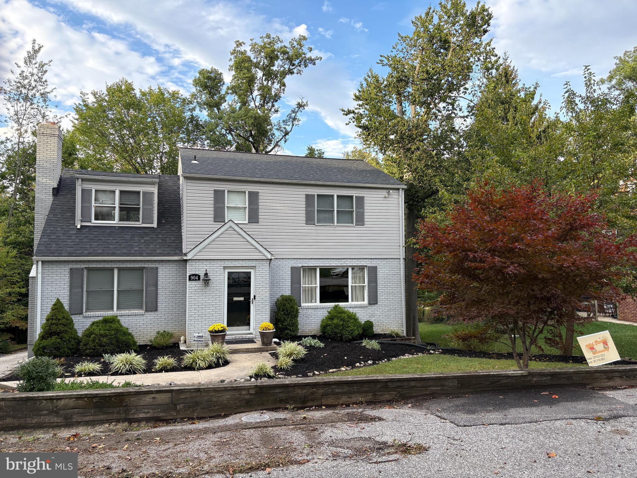 904 Litchfield Road Baltimore, MD 21239 - Photo 6 of 13 front view of a house with a yard