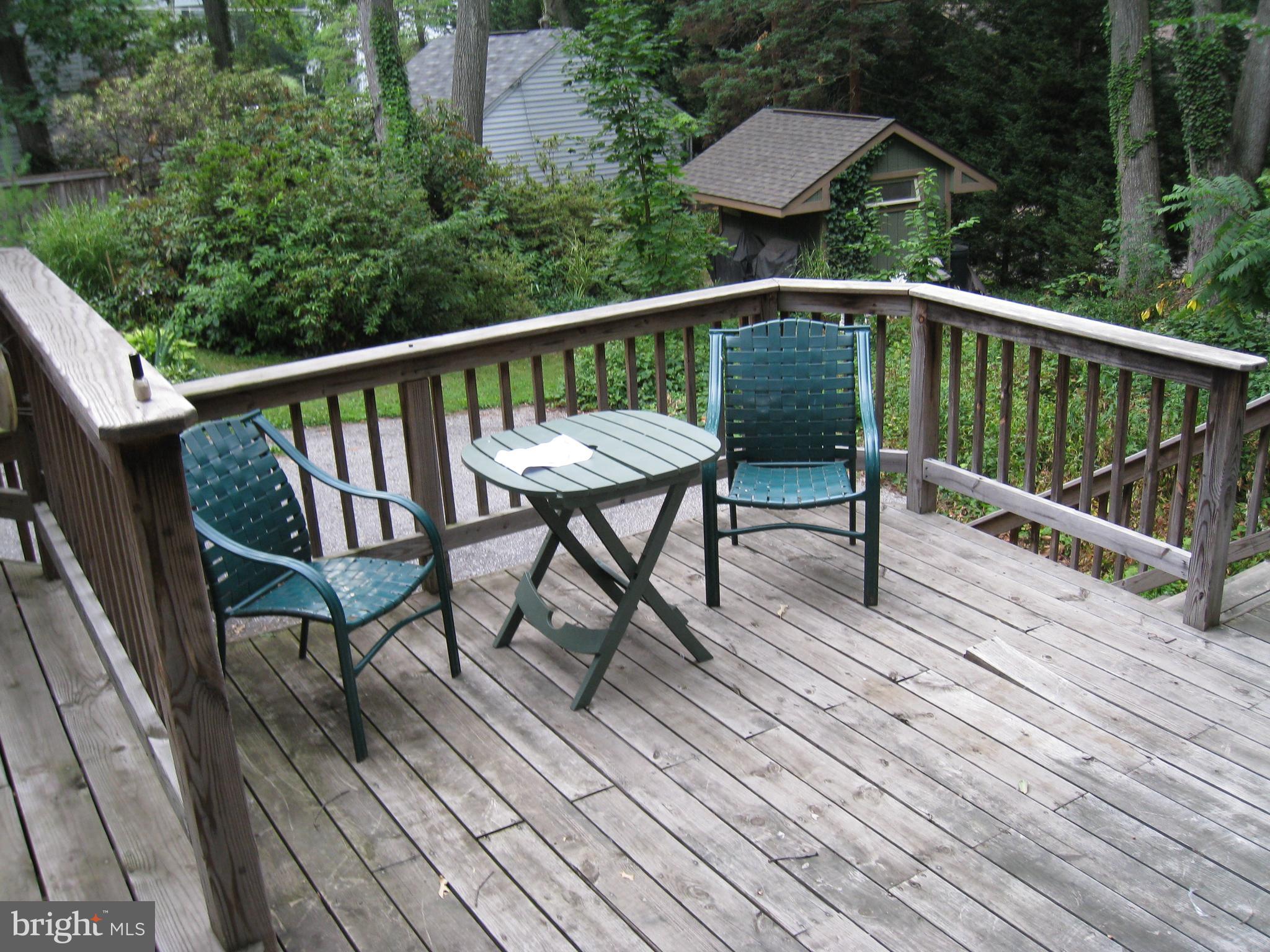 904 Litchfield Road Baltimore, MD 21239 - Photo 9 of 13 a view of balcony with wooden floor and outdoor seating