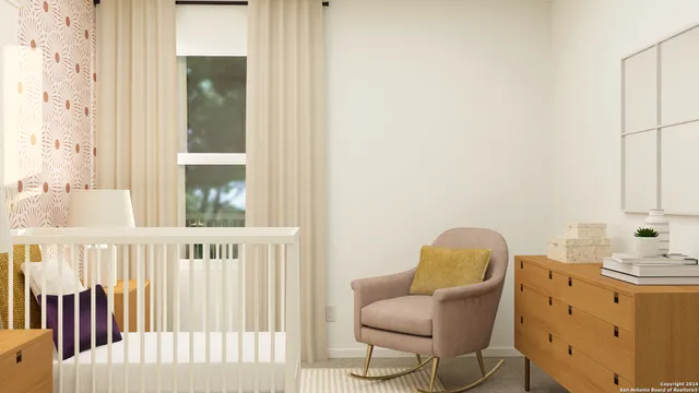 a view of a bedroom with furniture