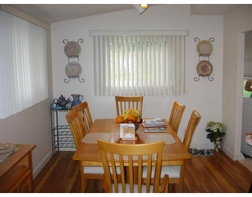 11 Daley Street Needham, MA 02494 - Photo 4 of 6 a view of a dining room with furniture and wooden floor
