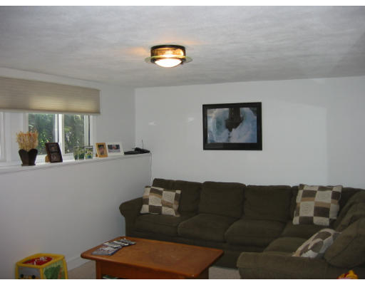 11 Daley Street Needham, MA 02494 - Photo 6 of 6 a living room with furniture and a window