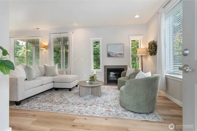 a living room with furniture and a fireplace