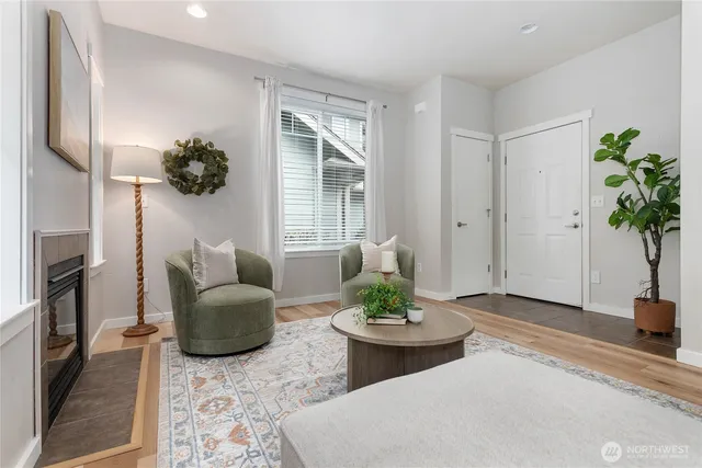a view of a dining room with furniture and a potted plant