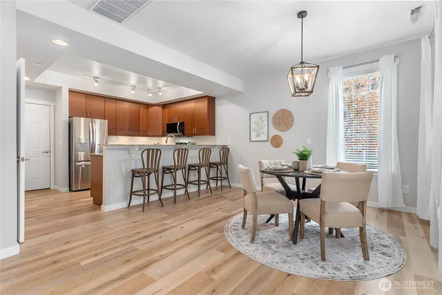 a view of a dining room with furniture window and wooden floor