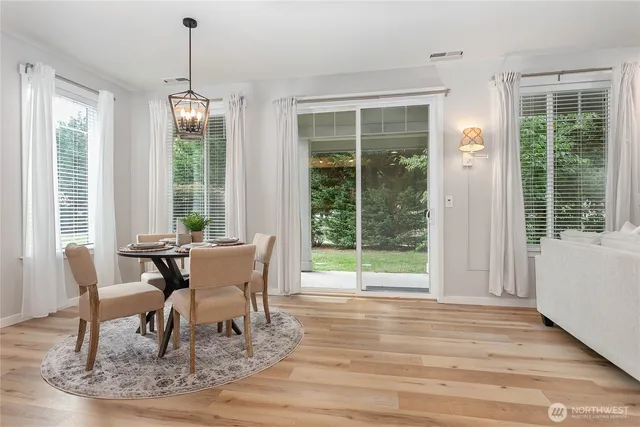 a view of a dining room with furniture window and outside view