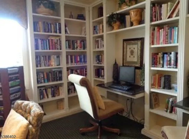 a view of a house with pool and sitting area