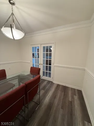 a room with wooden floor and a window