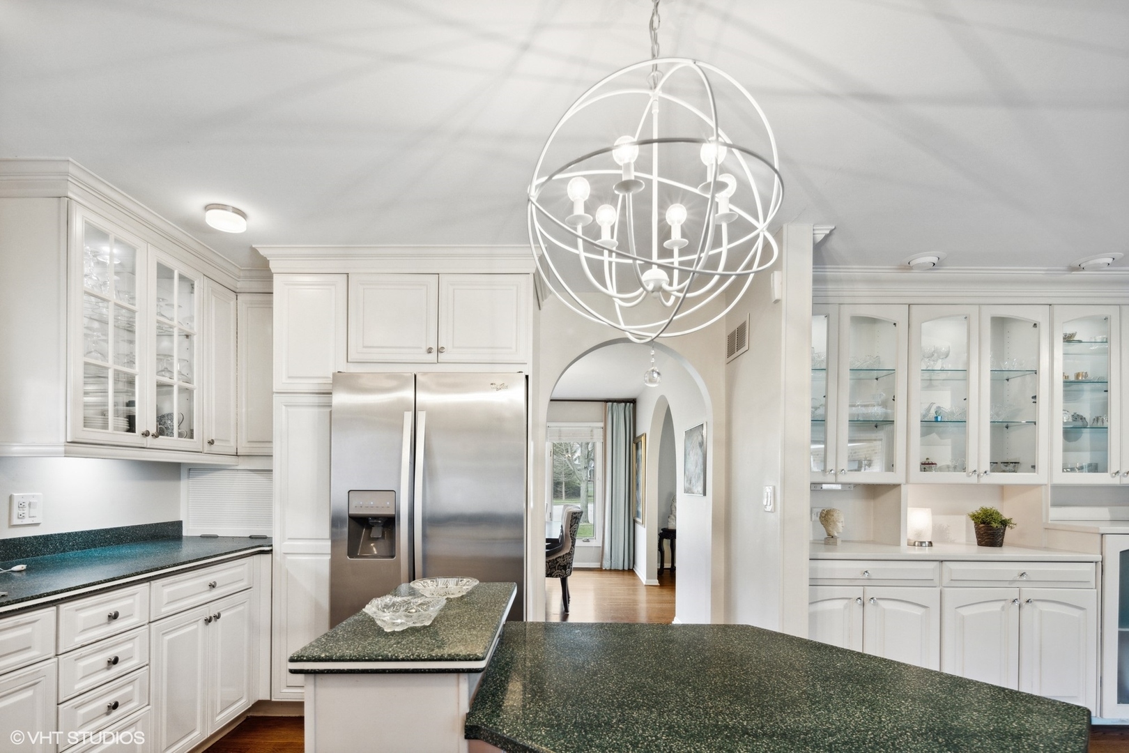 25 Princeton Road Hinsdale, IL 60521 - Photo 18 of 39 a kitchen with stainless steel appliances a chandelier a stove cabinets and chandelier