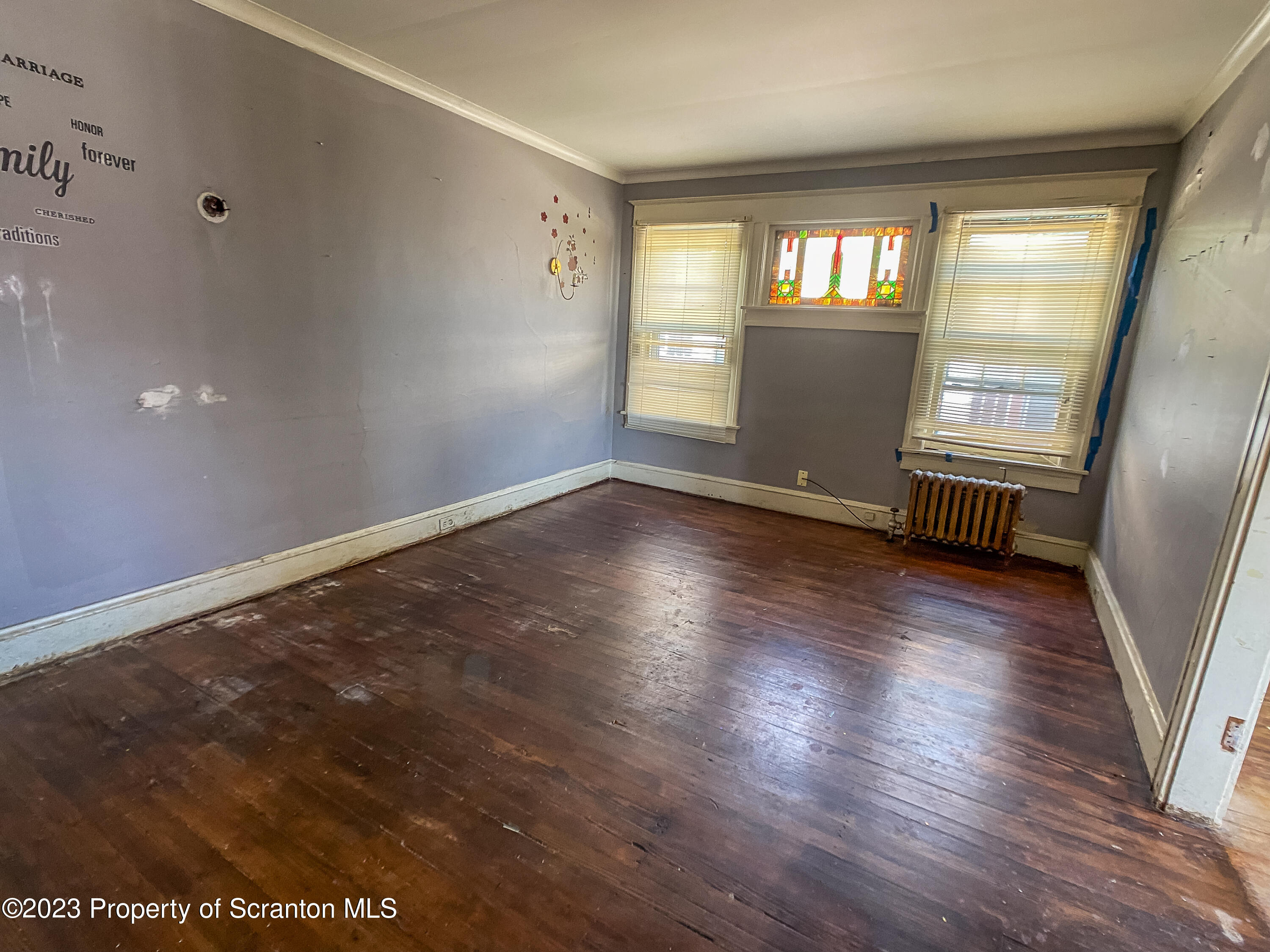 509 North Main Avenue Scranton, PA 18504 - Photo 15 of 16 an empty room with wooden floor and windows
