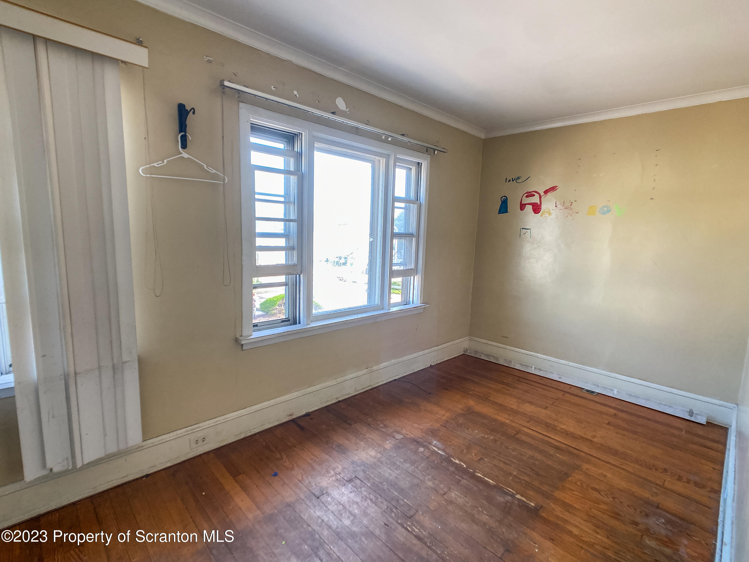 509 North Main Avenue Scranton, PA 18504 - Photo 16 of 16 a view of an empty room with a window and wooden floor