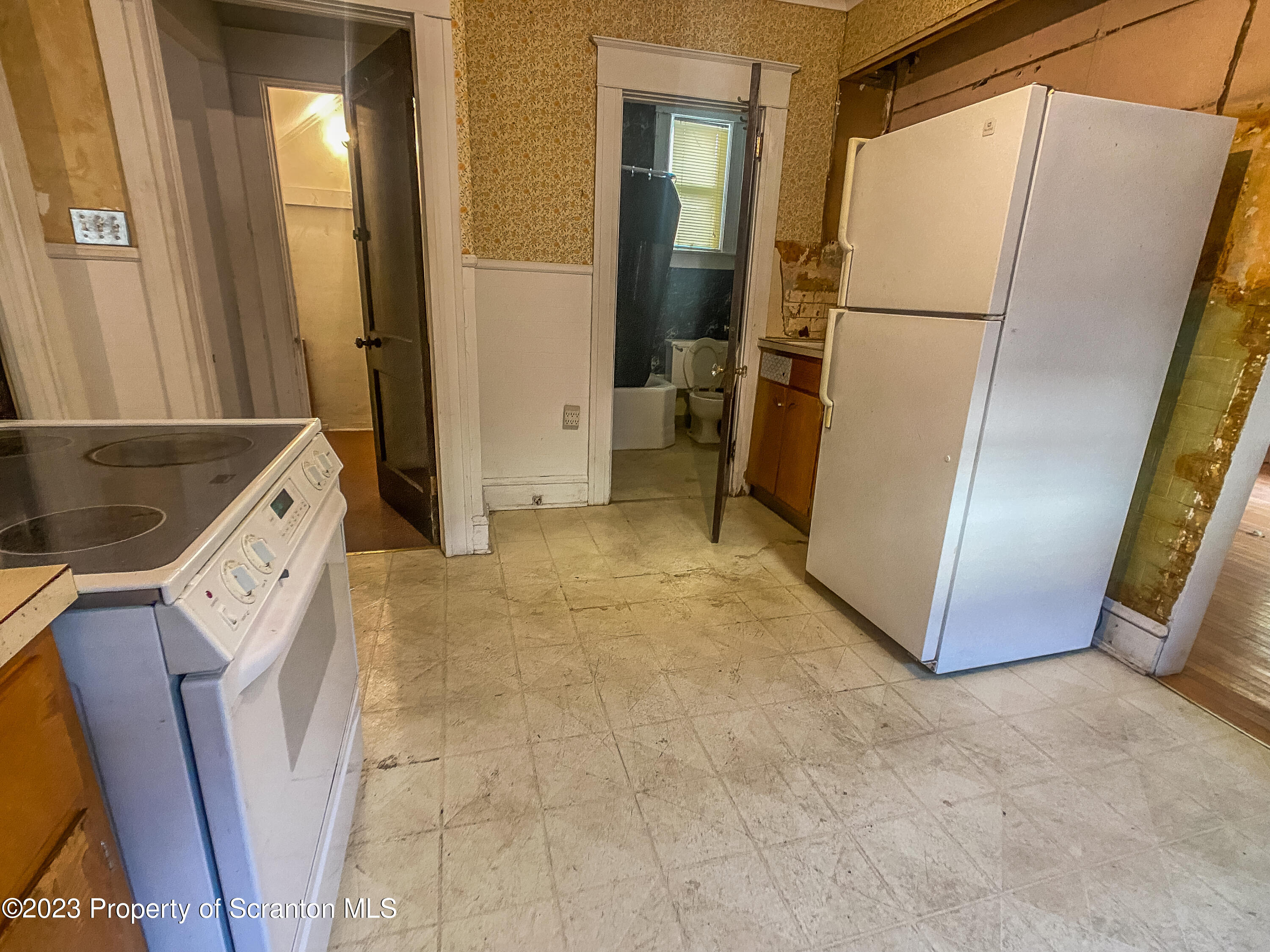 509 North Main Avenue Scranton, PA 18504 - Photo 8 of 16 a view of a storage & utility room with refrigerator washer and dryer