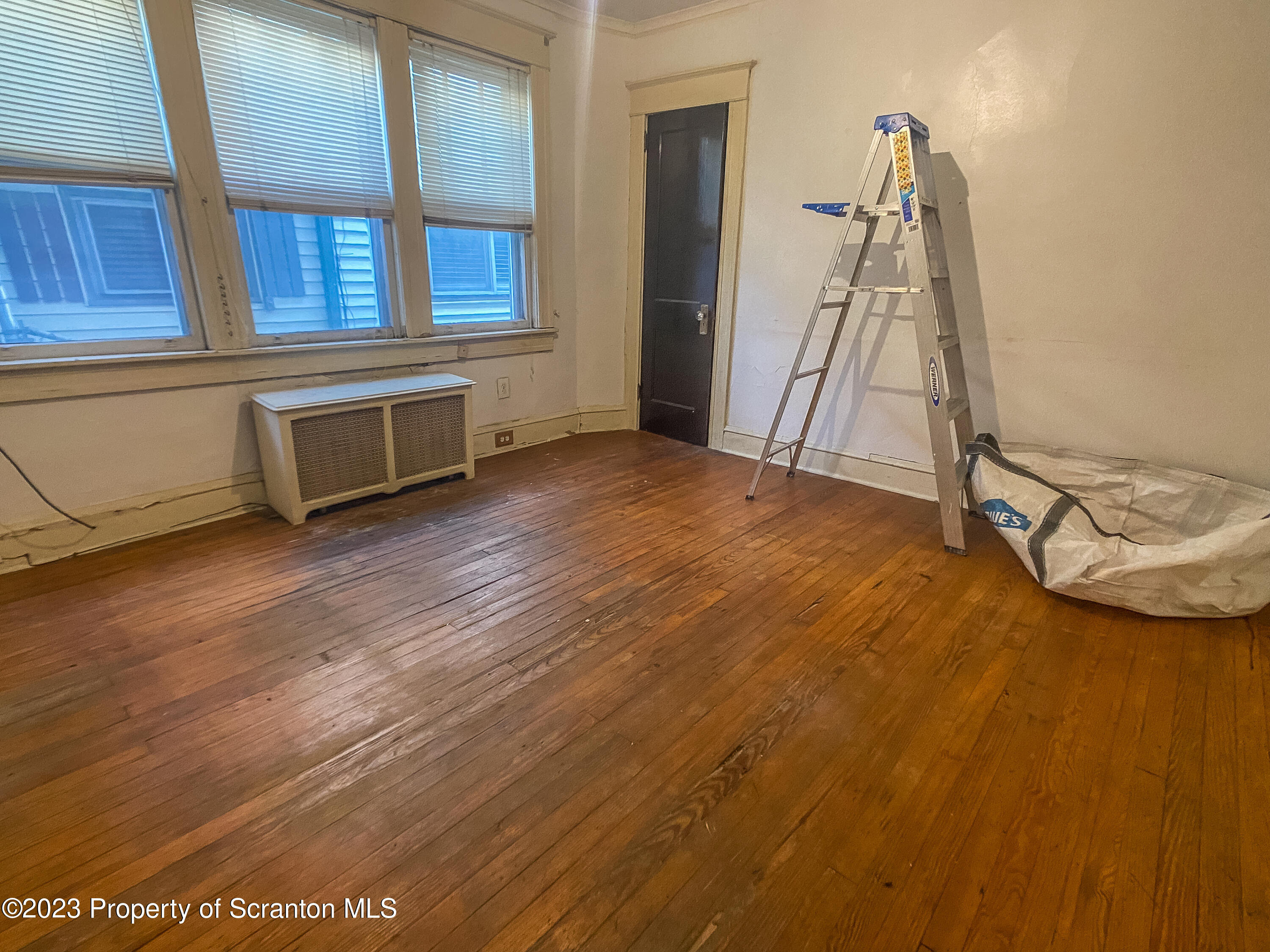 509 North Main Avenue Scranton, PA 18504 - Photo 9 of 16 a view of a livingroom with wooden floor and a ceiling fan
