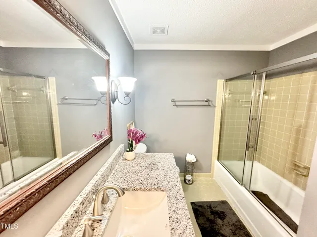 a bedroom with two beds and a window