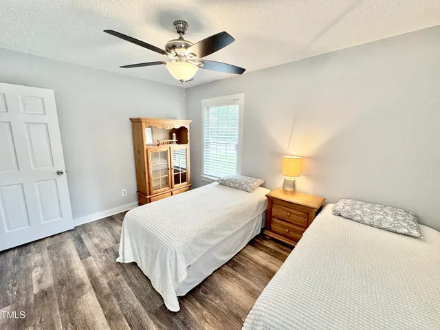 a bedroom with double bed and a large mirror