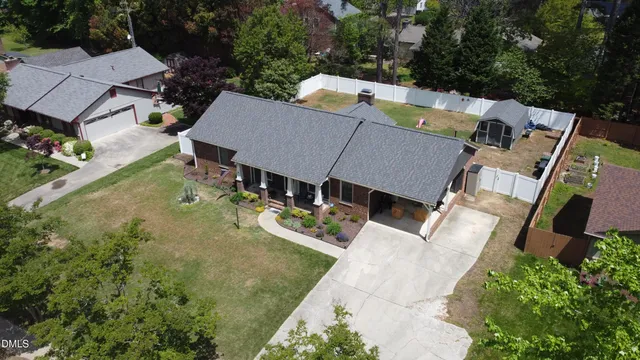 an aerial view of a house with outdoor space