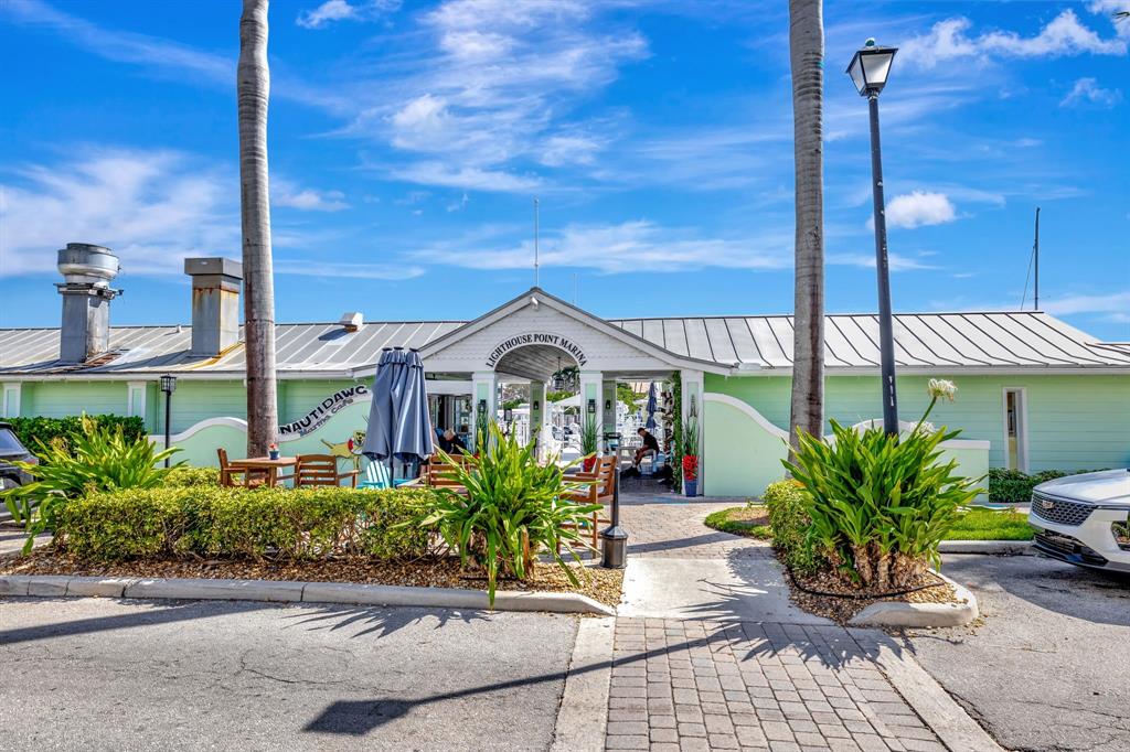 2755 Northeast 28th Avenue, Unit A3 Lighthouse Point, FL 33064 - Photo 18 of 27 a view of a garden with potted plants