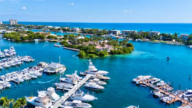 a view of a patio with a table and chairs under an umbrella