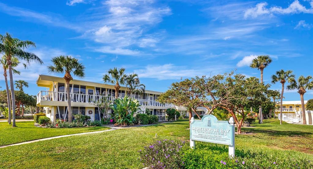 2755 Northeast 28th Avenue, Unit A3 Lighthouse Point, FL 33064 - Photo 4 of 27 a view of a building with a yard