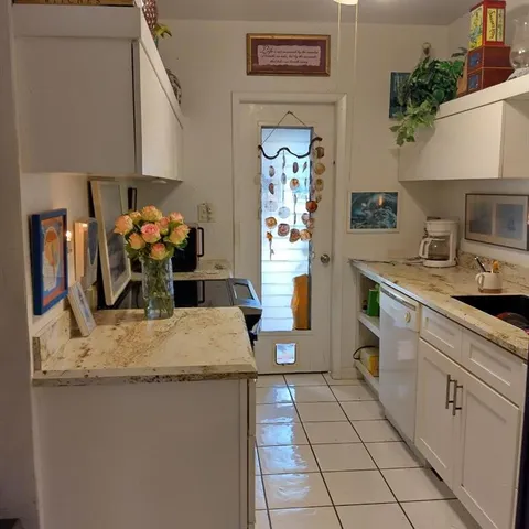 a living room with fireplace furniture and a floor to ceiling window