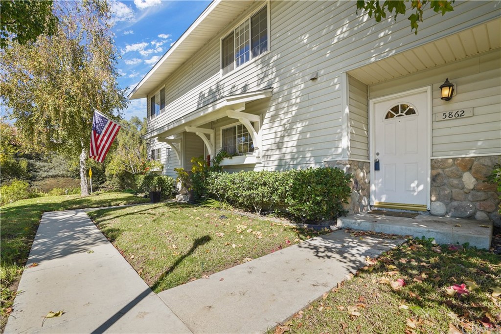 5862 Parkmor Road Calabasas, CA 91302 - Photo 1 of 1 a front view of a house with a yard and potted plants
