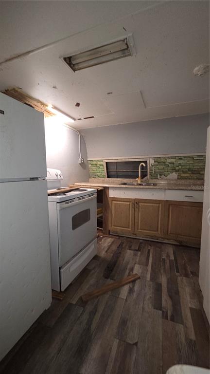 3000 Clarcona Road, Unit 510 Apopka, FL 32703 - Photo 5 of 8 a kitchen with stainless steel appliances granite countertop a sink stove and refrigerator
