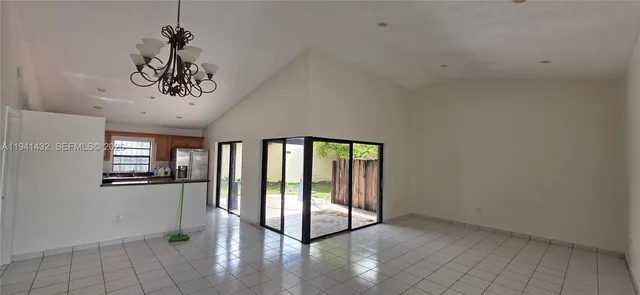 a kitchen with stainless steel appliances granite countertop a stove microwave and sink