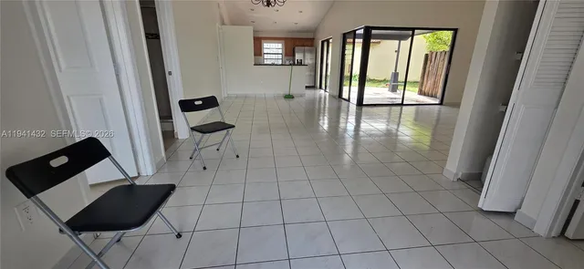 a kitchen with a refrigerator stove top oven and sink