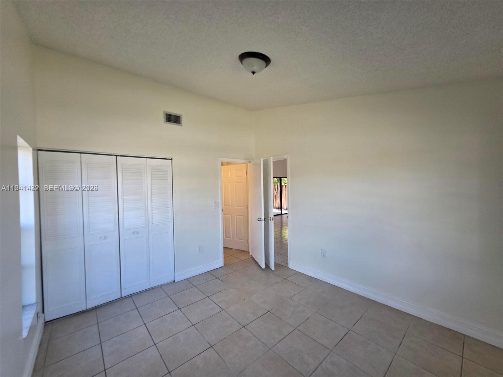 15238 Southwest 58th Terrace Miami, FL 33193 - Photo 17 of 38 a view of an empty room