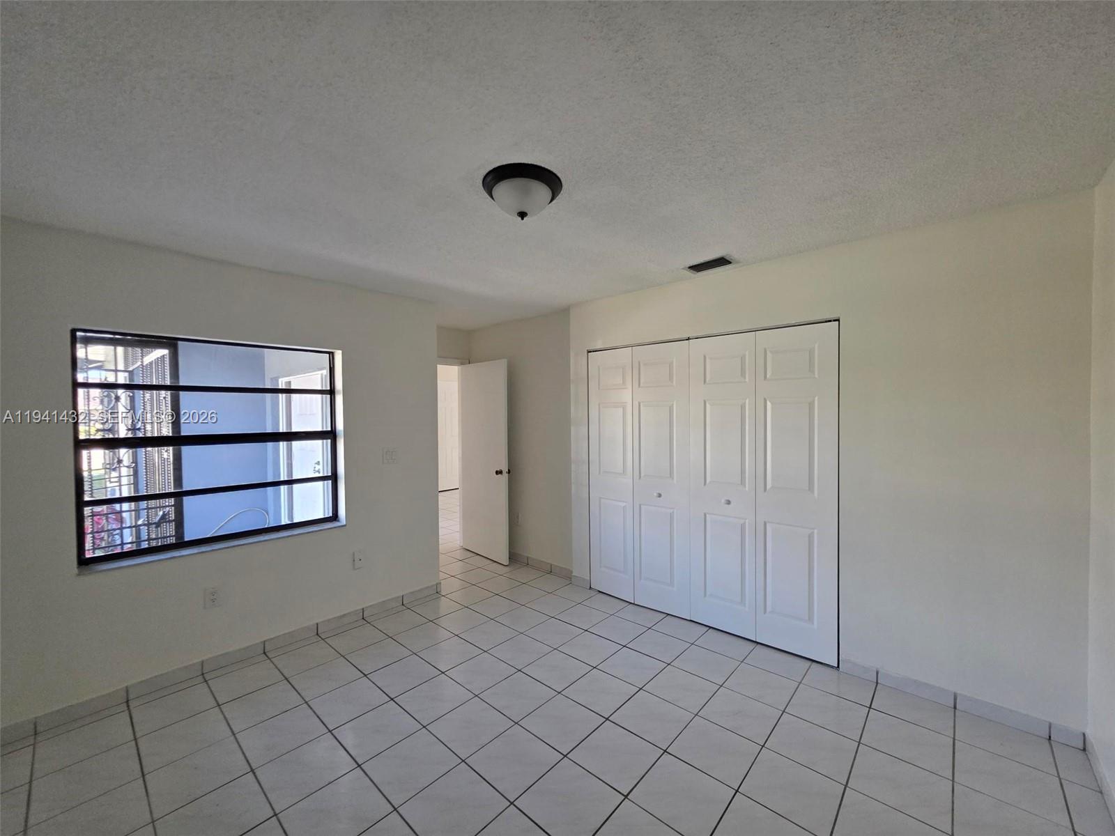 15238 Southwest 58th Terrace Miami, FL 33193 - Photo 18 of 38 a view of an empty room and window in a room